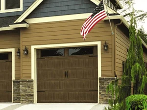 Technician repairing a residential garage door